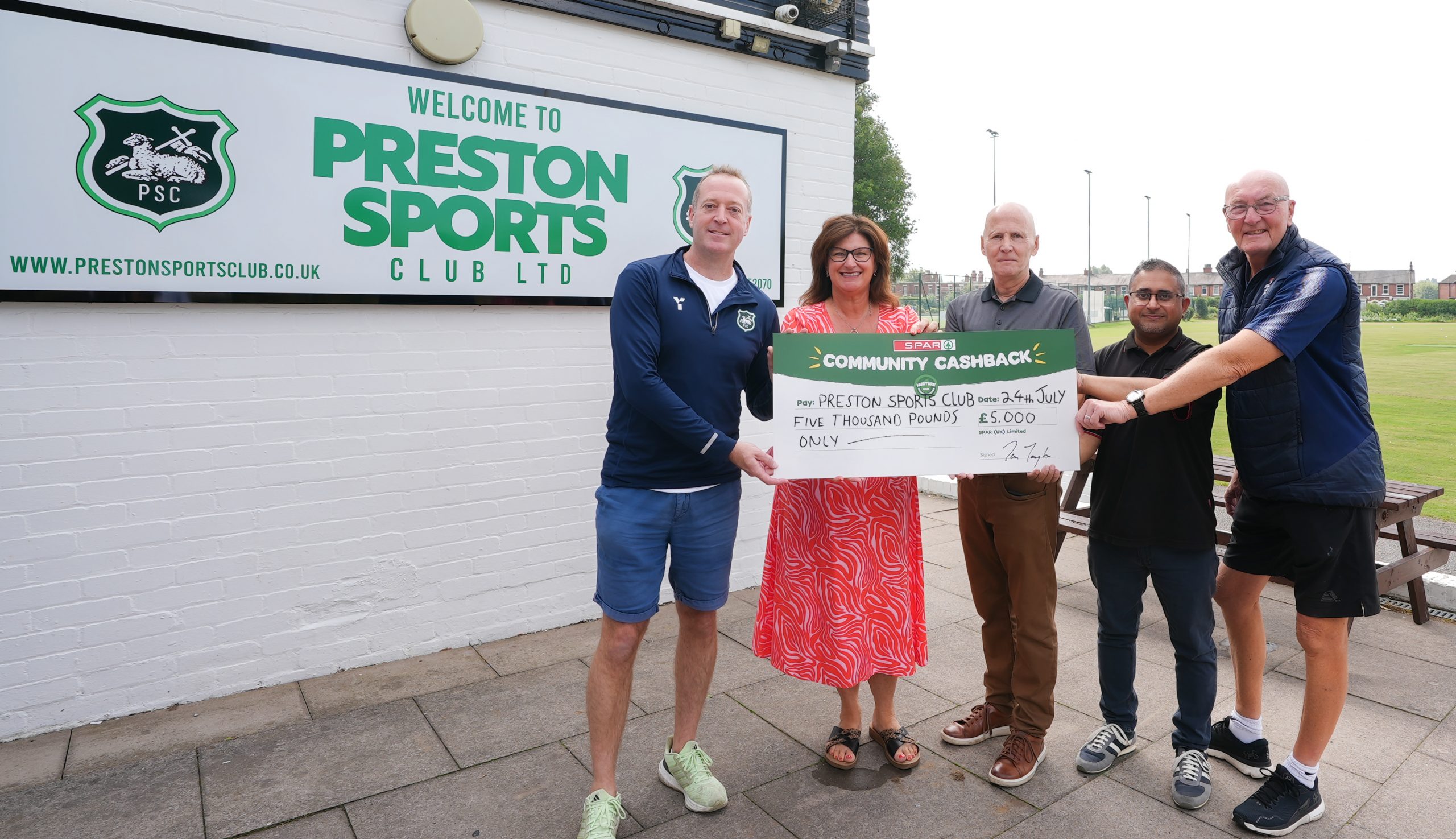 SPAR independent retailer Ajay Chapanery (centre right) at the Westcliff Ground alongside (centre left) Retail Sales Advisor Janet Anforth, of James Hall & Co. Ltd, Simon Marshall, Chair of Preston Sports Club Ltd (centre), Dave Wilson, from Preston Cricket Club (far right) and Kieron Morrow, from Preston Hockey Club (far left).