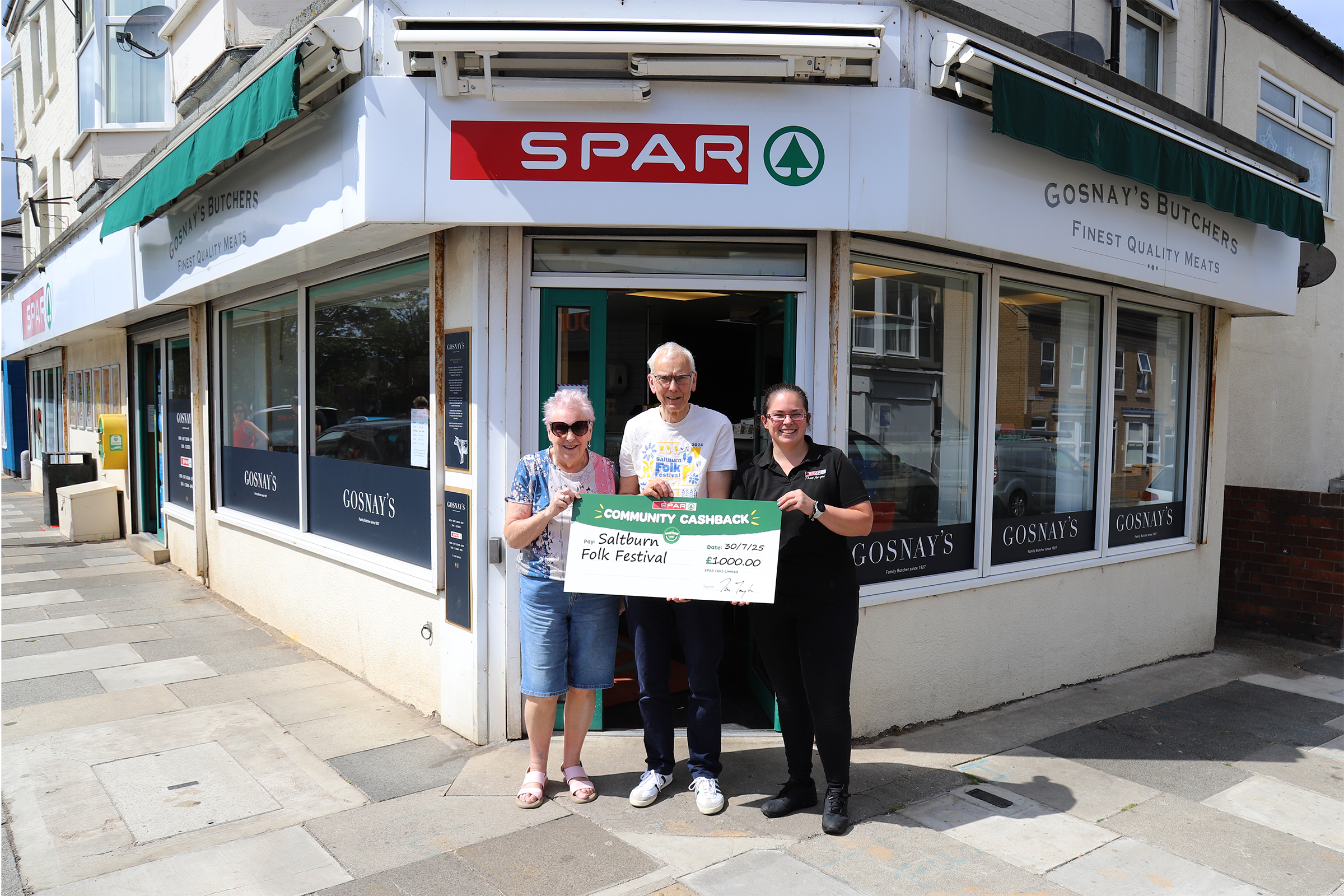 SPAR Community Cashback Saltburn Folk Festival SPAR independent retailer Rachael Gosnay with Nigel Carden, Operations Director at the Saltburn Folk Festival, and Marjorie Inganni, longtime friend of the festival.