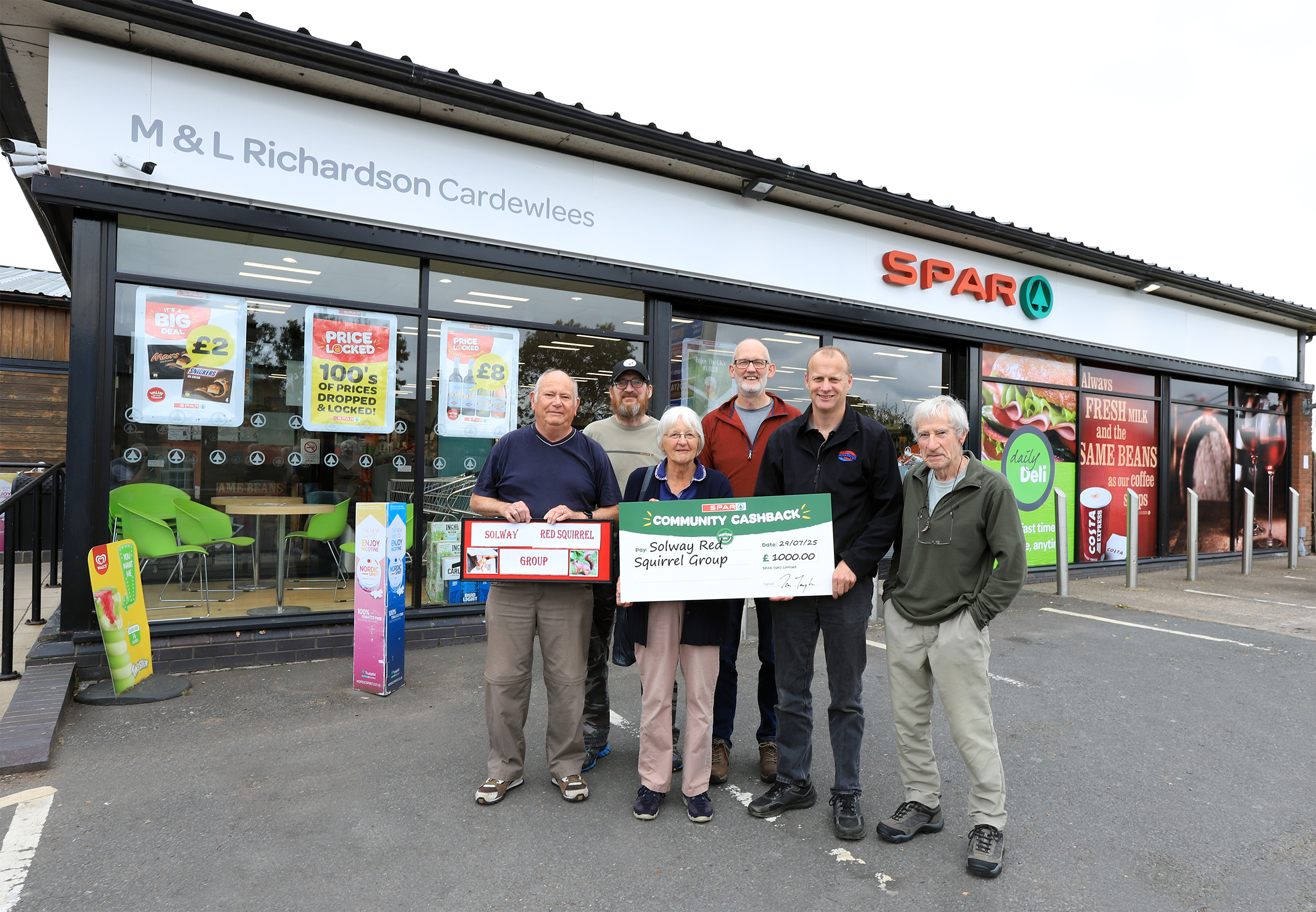 Martyn Richardson, Managing Director of M&L Richardson & Sons Ltd, was on hand to meet members of the Solway Red Squirrel Group outside his SPAR store at Cardewlees to present the SPAR Community cashback cheque.