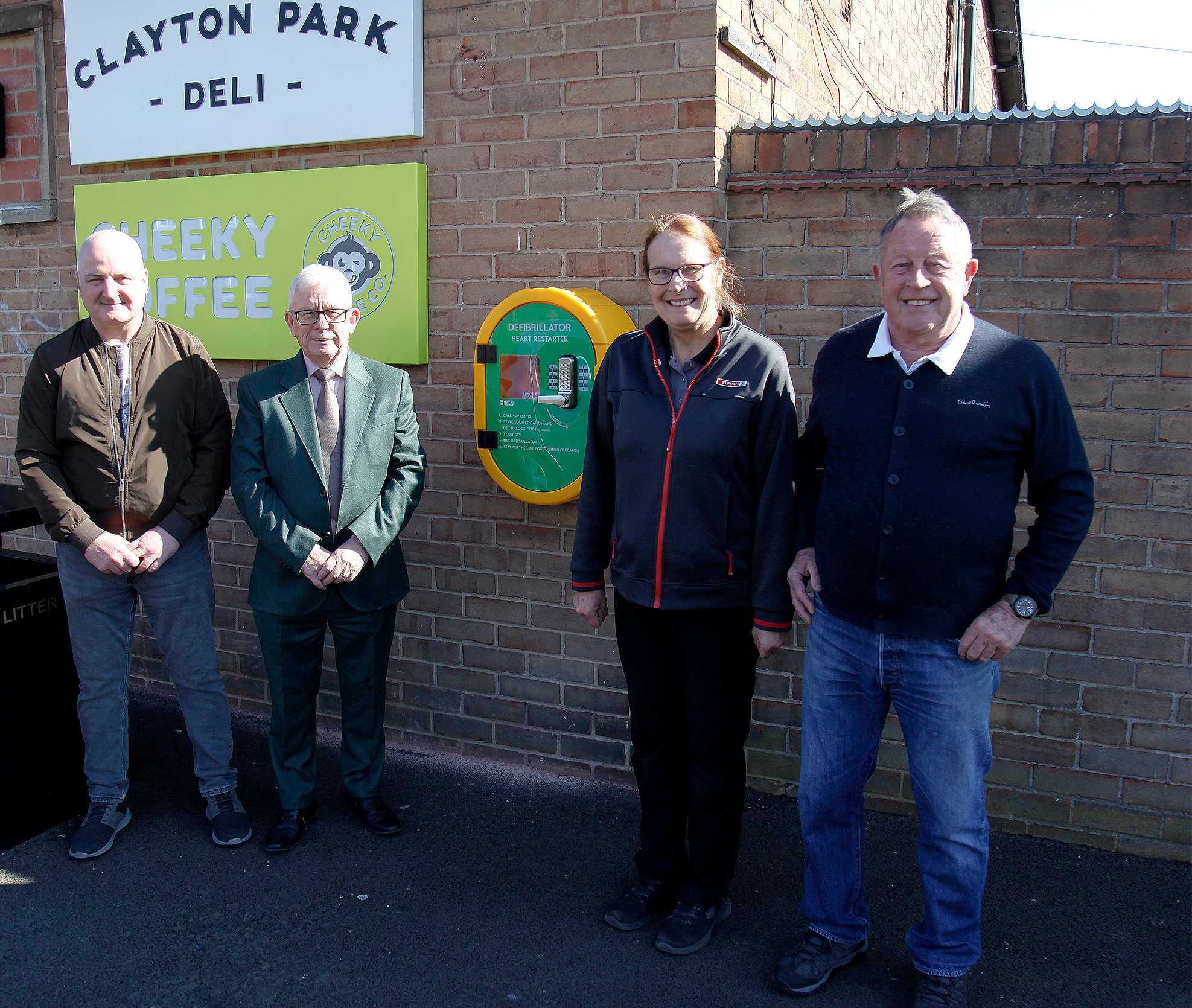 The defibrillator in-situ at SPAR Mendip Avenue with (from l-r) Durham County Councillor Paul Sexton; Dave Pickford, Retail Services Director at James Hall & Co. Ltd, owner of SPAR Mendip Avenue; Store Manager Julie-Ann Lamb; and Durham County Councillor Bill Moist.
